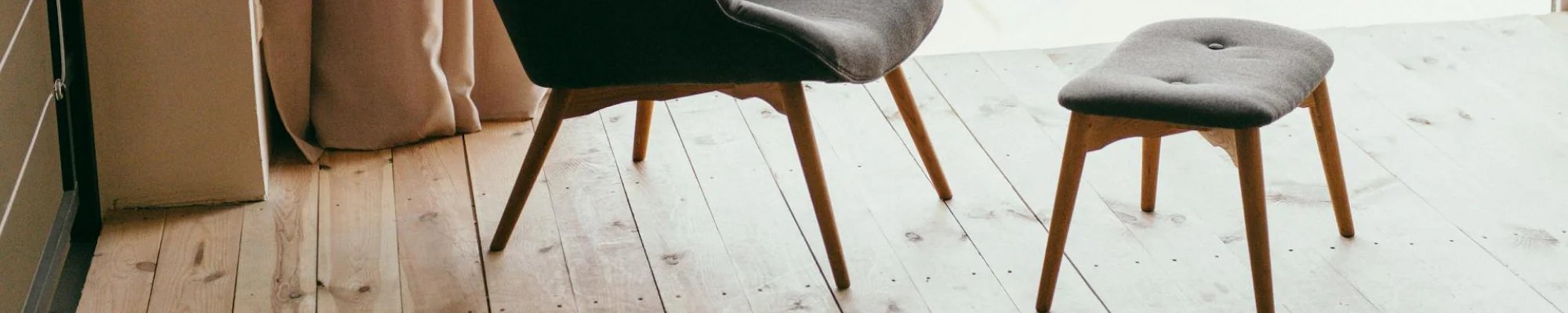 chic chair and ottoman on beautiful wood floor