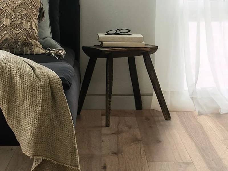 hardwood flooring with small side table